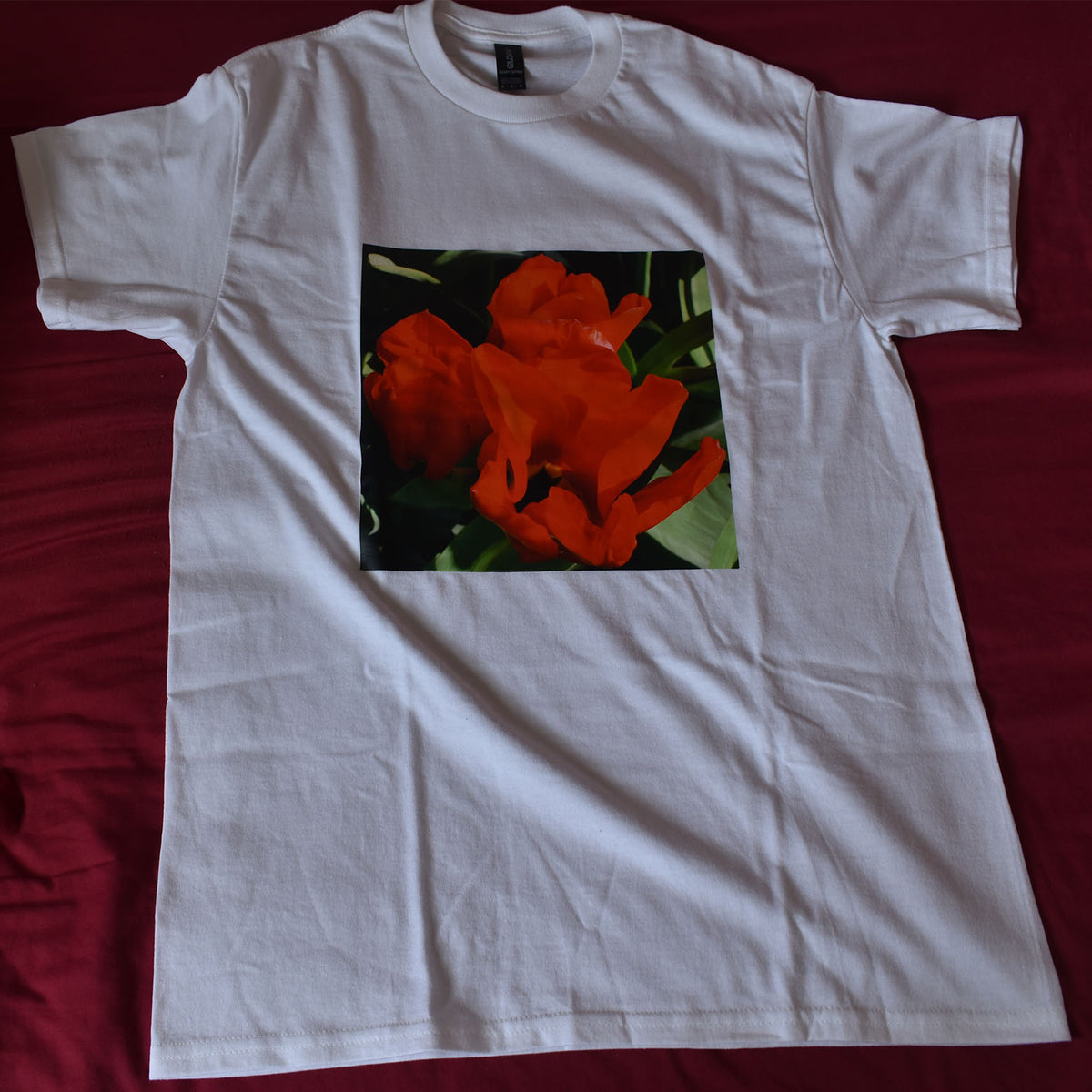 Red flower from Durham Park printed onto a white t-shirt